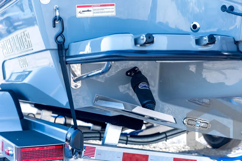 Slide: The Image of 2026 Pathfinder 2300 HPS boat rear view, showcasing trailer and hull details. - 26