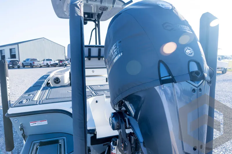 Slide: The Image of 2026 Pathfinder 2300 HPS boat with covered outboard motor in a sunny outdoor setting. - 29