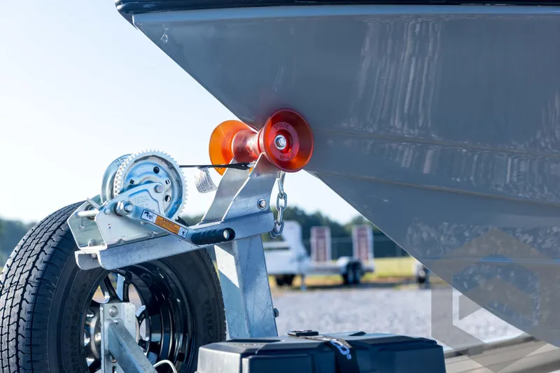 Slide: The Image of 2026 Pathfinder 2300 HPS boat on trailer with winch and orange roller. - 38