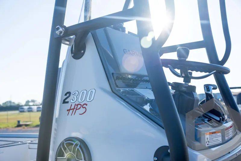 Slide: The Image of Pathfinder 2300 HPS boat console with Garmin equipment, 2026 model, sunlit background. - 48