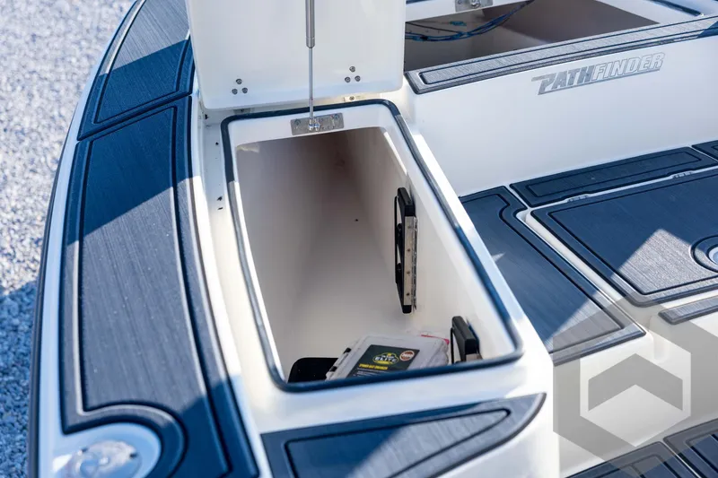 Slide: The Image of 2026 Pathfinder 2300 HPS boat storage compartment with open lid, showcasing interior details. - 61