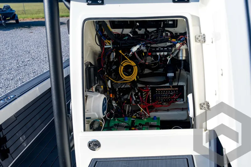 Slide: The Image of Electrical compartment of 2026 Pathfinder 2300 HPS boat, showcasing wiring and components. - 66