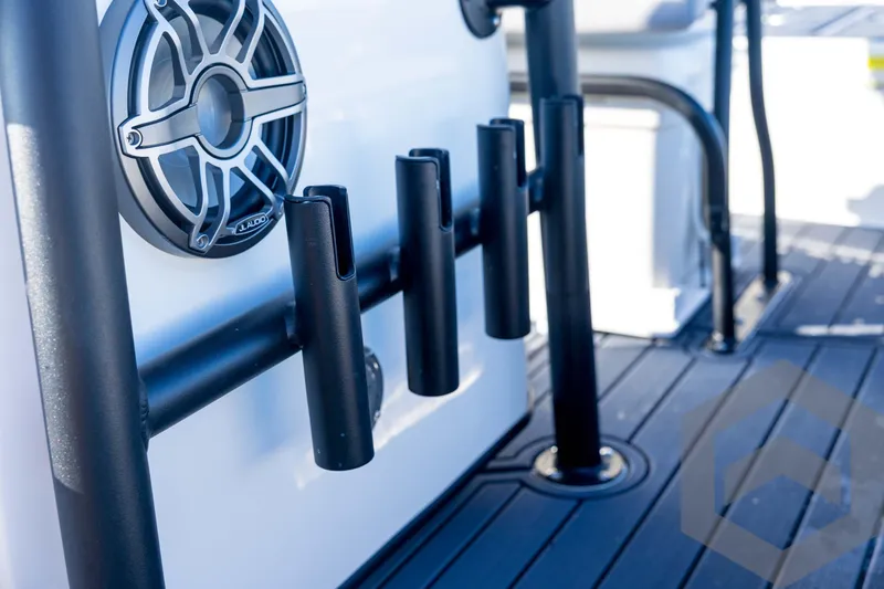 Slide: The Image of 2026 Pathfinder 2300 HPS boat with rod holders and speaker detail. - 72