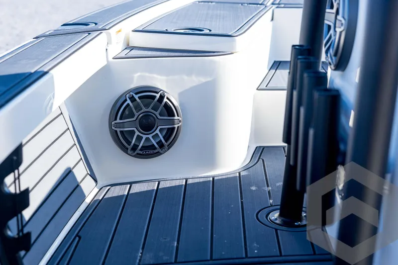 Slide: The Image of 2026 Pathfinder 2300 HPS boat interior with speaker and rod holders. - 73
