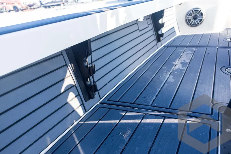 Slide: The Image of 2026 Pathfinder 2300 HPS boat interior with sleek, modern deck design. - 76