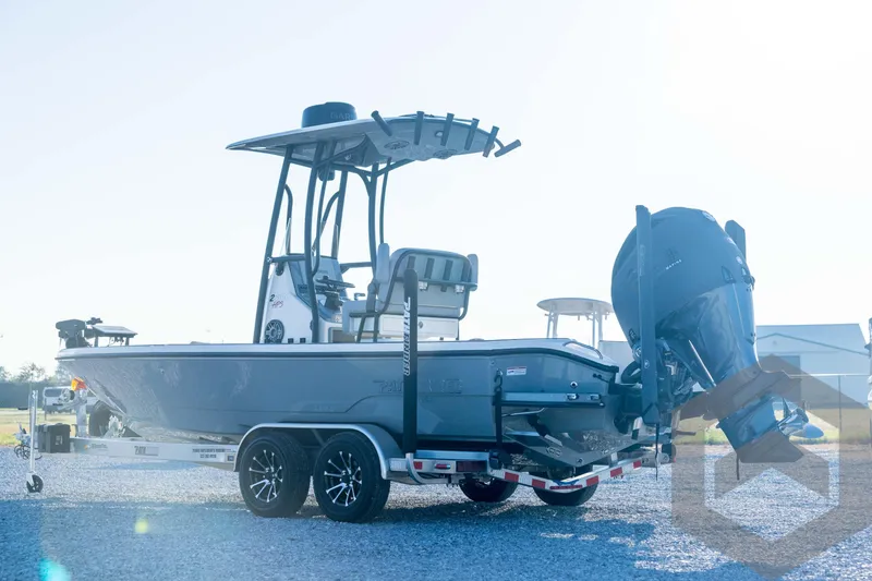 Slide: The Image of 2026 Pathfinder 2300 HPS boat on trailer, side view with outboard motor. - 8