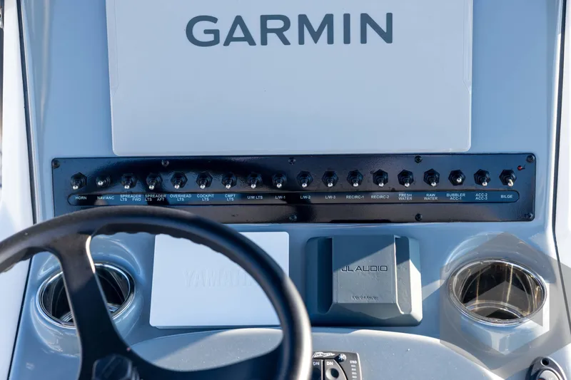 Slide: The Image of 2026 Pathfinder 2300 HPS boat dashboard with Garmin display and JL Audio system. - 80