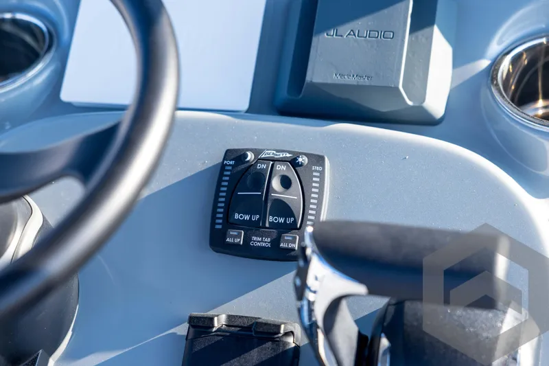 Slide: The Image of Close-up of 2026 Pathfinder 2300 HPS boat controls and JL Audio system. - 81