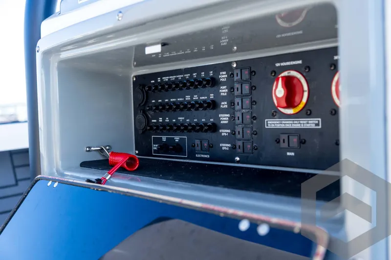 Slide: The Image of 2026 Pathfinder 2300 HPS control panel with switches and red safety cord. - 88