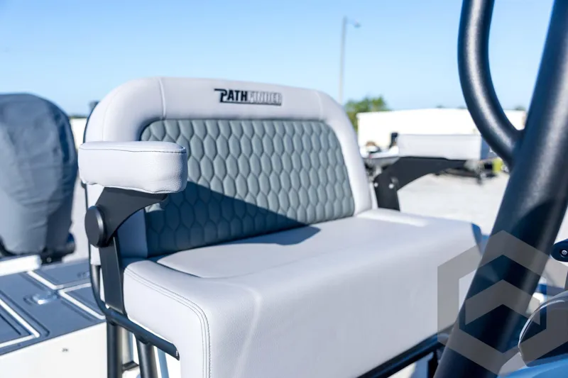Slide: The Image of 2026 Pathfinder 2300 HPS boat seat with armrest, featuring hexagonal pattern design. - 91