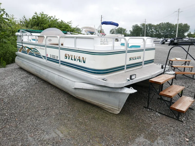 Slide: The Image of 1996 Sylvan 820 Cruise Special Edition pontoon boat on gravel lot. - 1