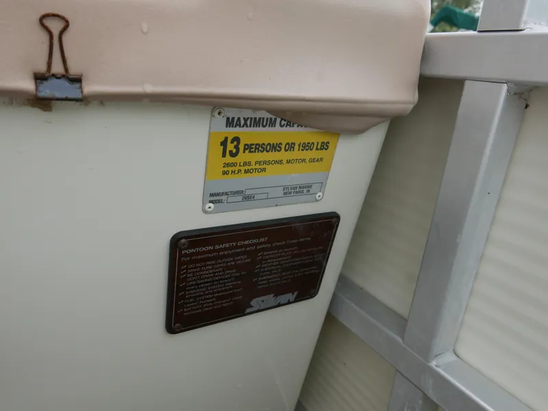 Slide: The Image of 1996 Sylvan 820 Cruise Special Edition capacity label, 13 persons or 1950 lbs, safety checklist. - 10