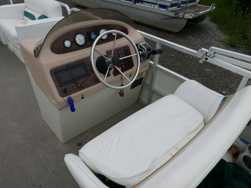 Slide: The Image of 1996 Sylvan 820 Cruise Special Edition boat interior with steering wheel and dashboard. - 9