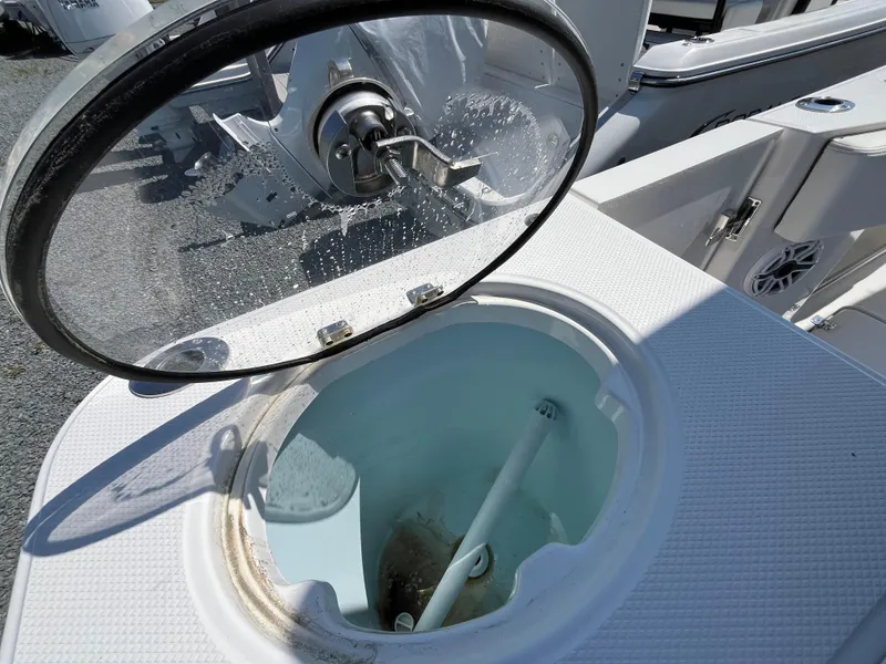 Slide: The Image of 2024 Robalo R270 Center Console boat interior with seating and console view. - 7