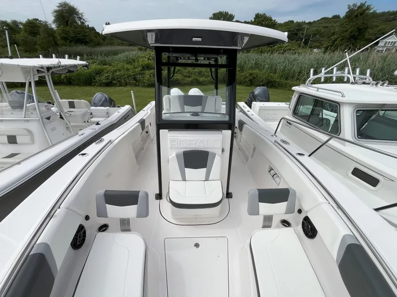 Slide: The Image of 2025 Robalo R270 Center Console boat interior with compact marine toilet. - 10