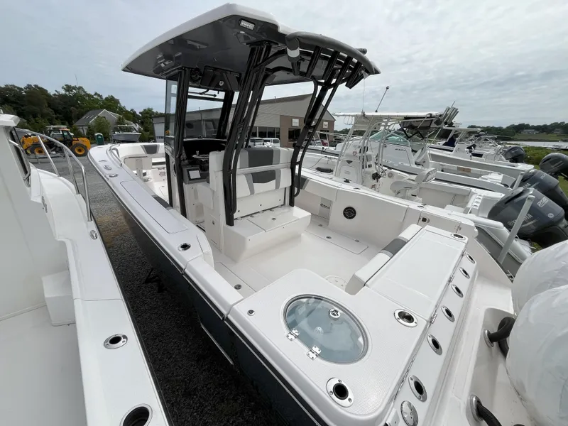 Slide: The Image of 2025 Robalo R270 Center Console boat interior with spacious deck and storage compartments. - 2
