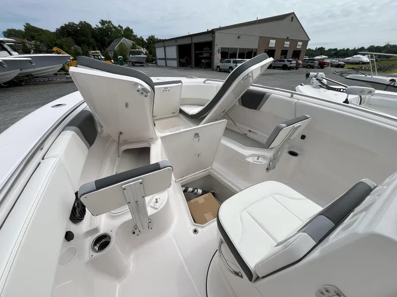Slide: The Image of 2025 Robalo R270 Center Console anchor locker with open hatch and winch system. - 8