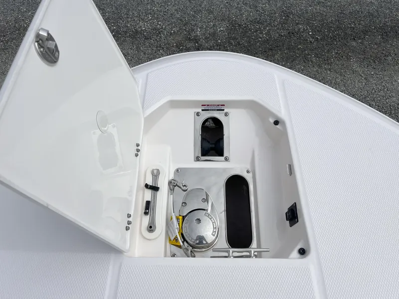 Slide: The Image of 2025 Robalo R270 Center Console boat interior with seating and console view. - 9