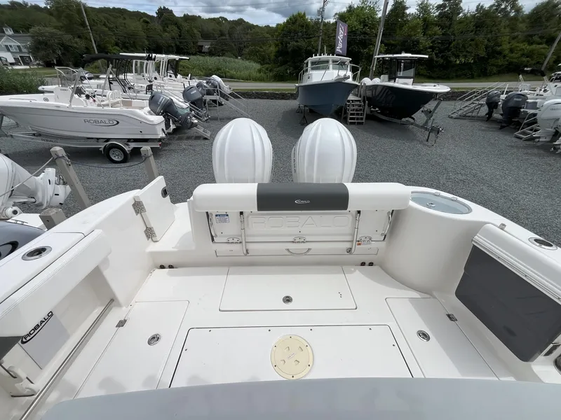 Slide: The Image of 2024 Robalo R302 Center Console with dual outboard engines, viewed from above. - 6