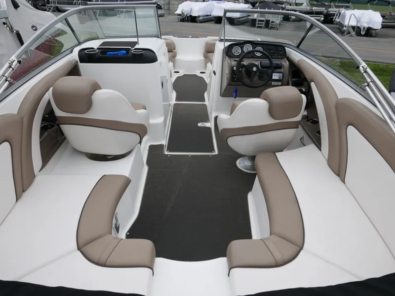 Slide: The Image of Interior of a 2011 Yamaha SX240 boat with beige seating. - 6