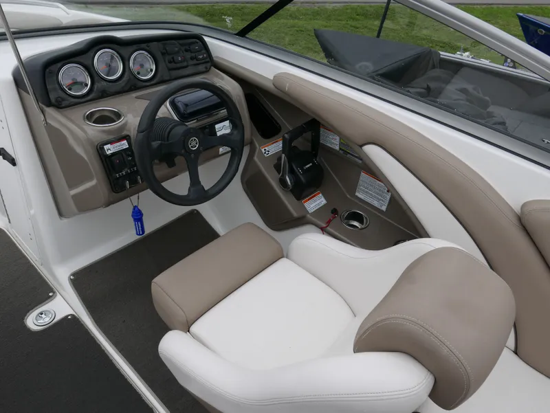 Slide: The Image of Interior of a 2011 Yamaha SX240 boat with steering console. - 8