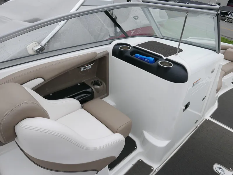 Slide: The Image of Interior of a 2011 Yamaha SX240 boat with beige seating. - 9