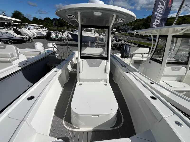 Slide: The Image of 2024 Parker 2400 Center Console boat interior with storage and compact toilet. - 10