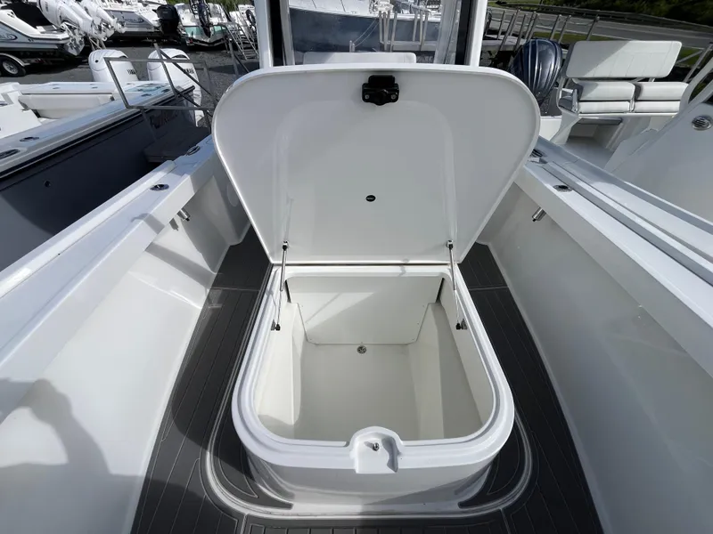 Slide: The Image of 2024 Parker 2400 Center Console boat interior with sleek, modern design and durable flooring. - 11