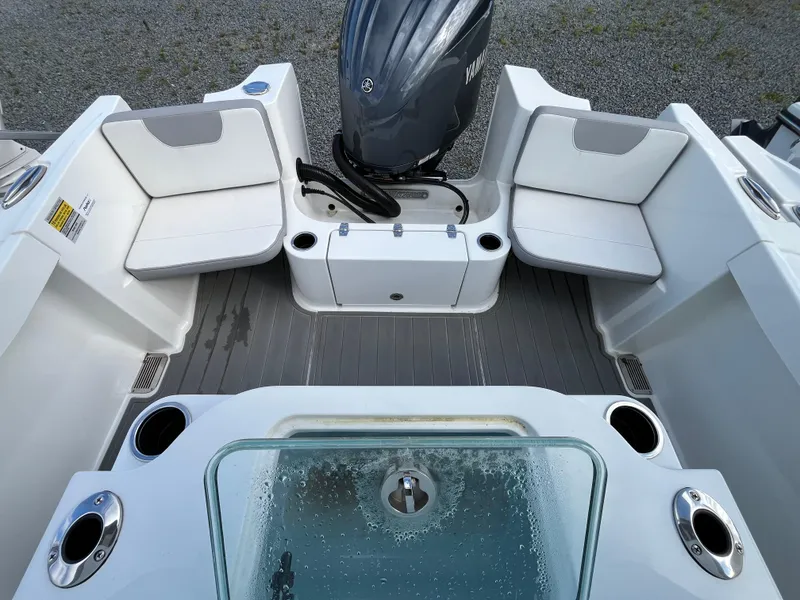Slide: The Image of 2024 Parker 2400 Center Console boat dashboard with steering wheel and controls. - 4