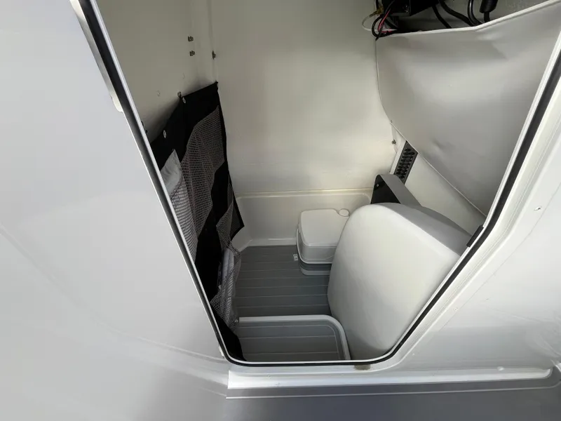 Slide: The Image of 2024 Parker 2400 Center Console boat interior with seating and storage compartments. - 6