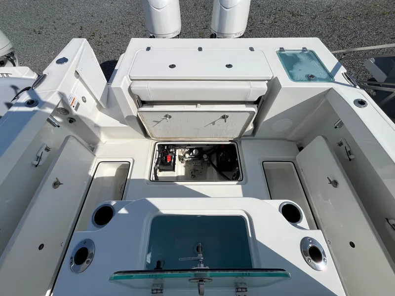 Slide: The Image of 2024 Parker 2600 Center Console boat interior with storage compartments and livewell. - 4