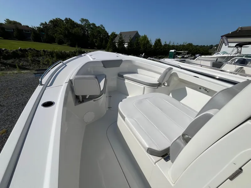 Slide: The Image of 2024 Parker 2600 Center Console boat interior with white seating and sleek design. - 6