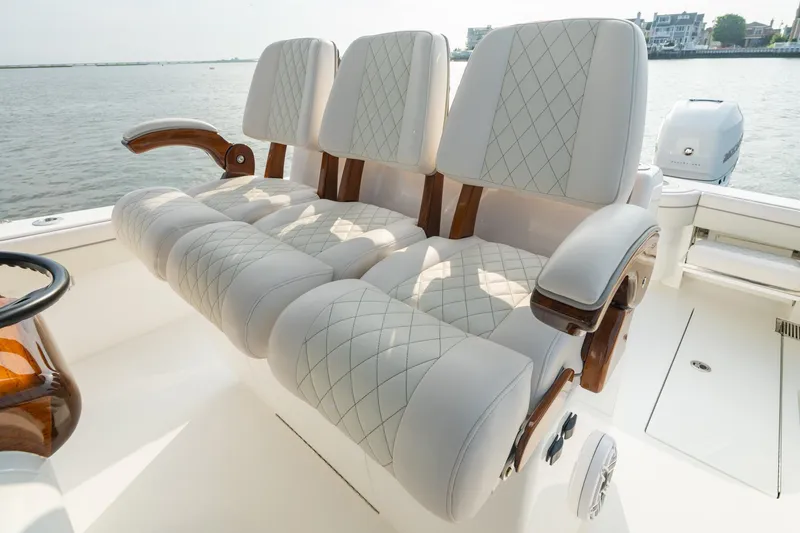 Slide: The Image of Luxurious seating on 2023 Valhalla Boatworks V-33, featuring elegant diamond-stitched upholstery. - 11