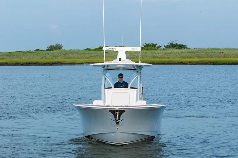 Slide: The Image of 2023 Valhalla Boatworks V-33 cruising on a calm waterway. - 2