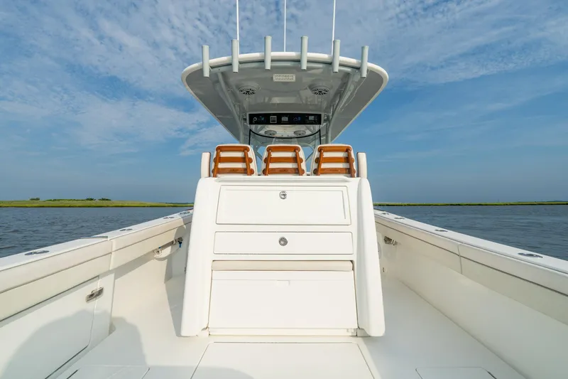 Slide: The Image of 2023 Valhalla Boatworks V-33, sleek design, open deck, clear sky, calm waters. - 8