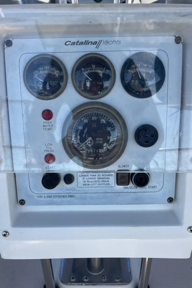 Slide: The Image of Control panel of a 1998 Catalina 400 sailboat with gauges and switches. - 15