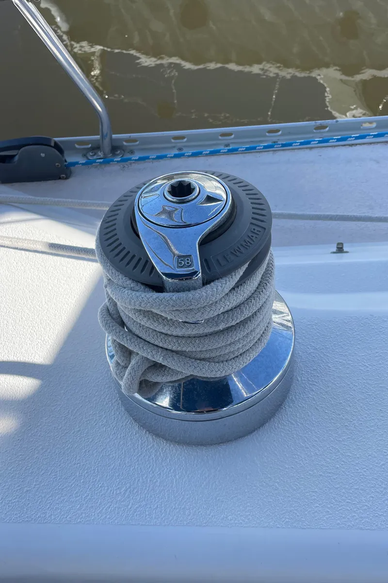 Slide: The Image of Winch on 1998 Catalina 400 sailboat deck with coiled rope. - 18