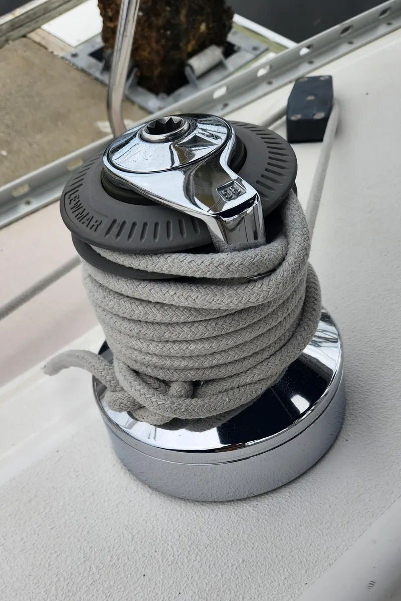 Slide: The Image of Winch on 1998 Catalina 400 sailboat with coiled rope, dockside view. - 19
