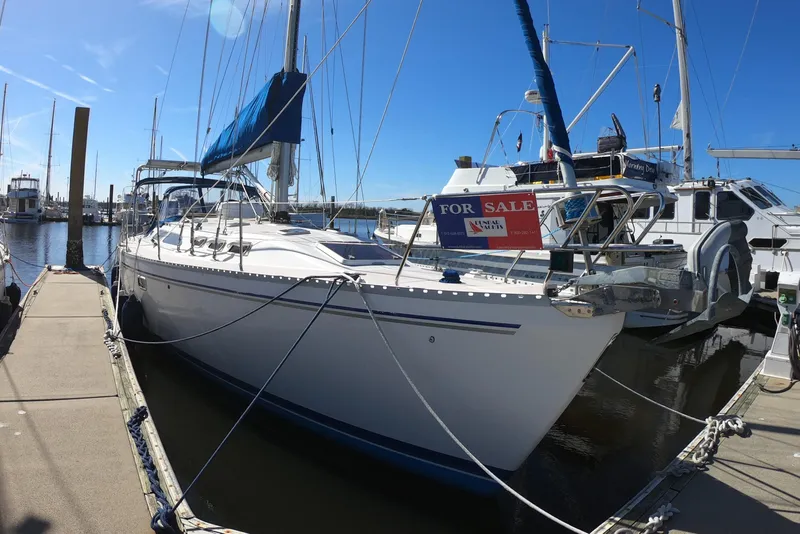 Slide: The Image of Sailboat Catalina 400, 1998 model, docked with "For Sale" sign, clear blue sky. - 2