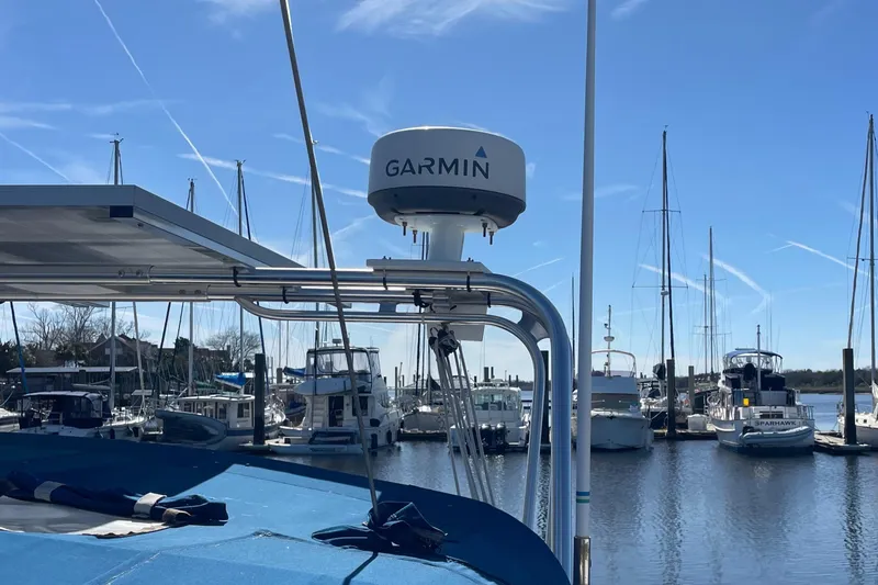 Slide: The Image of Catalina 400 sailboat with Garmin radar in a marina, clear blue sky, 1998 model. - 22