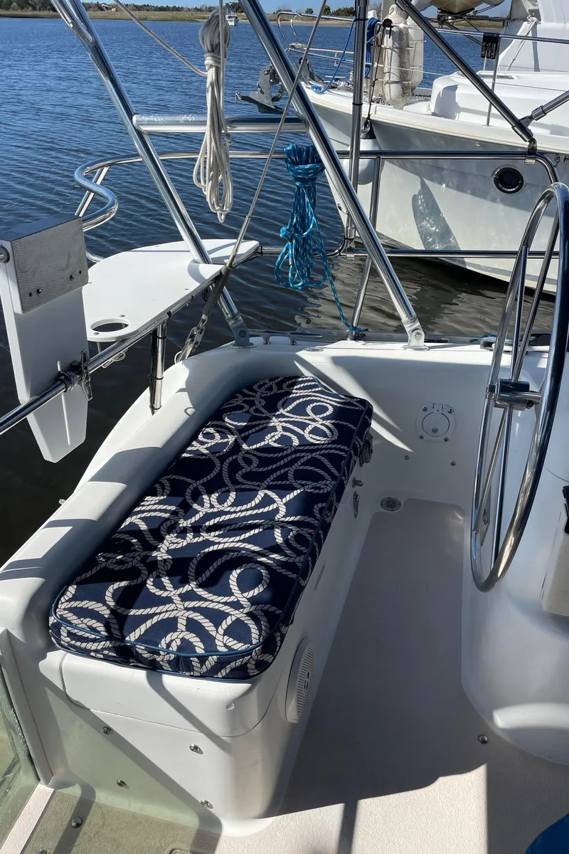 Slide: The Image of Cockpit of 1998 Catalina 400 sailboat with nautical-themed cushion. - 30