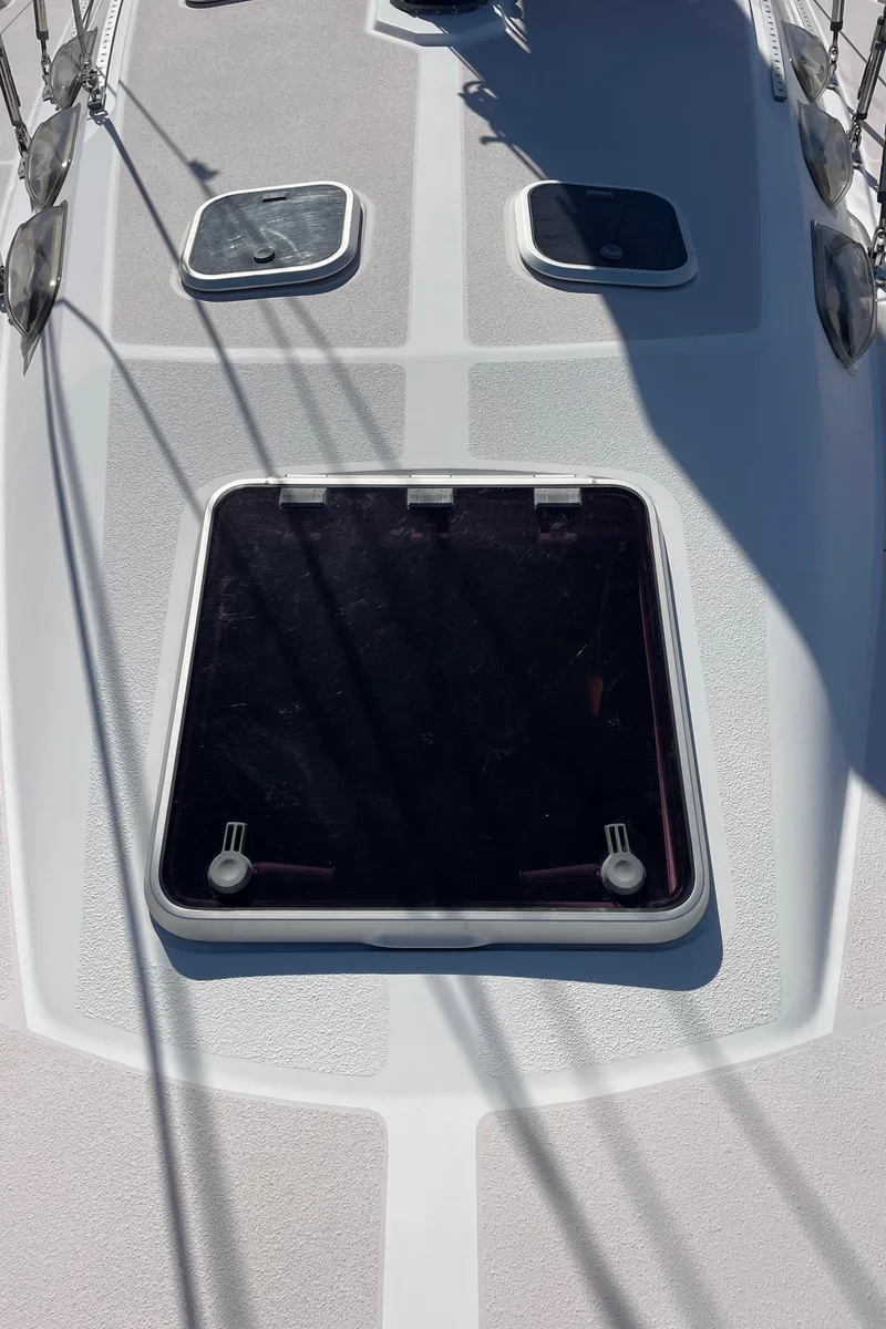 Slide: The Image of Deck of 1998 Catalina 400 sailboat with hatches and rigging shadows. - 42