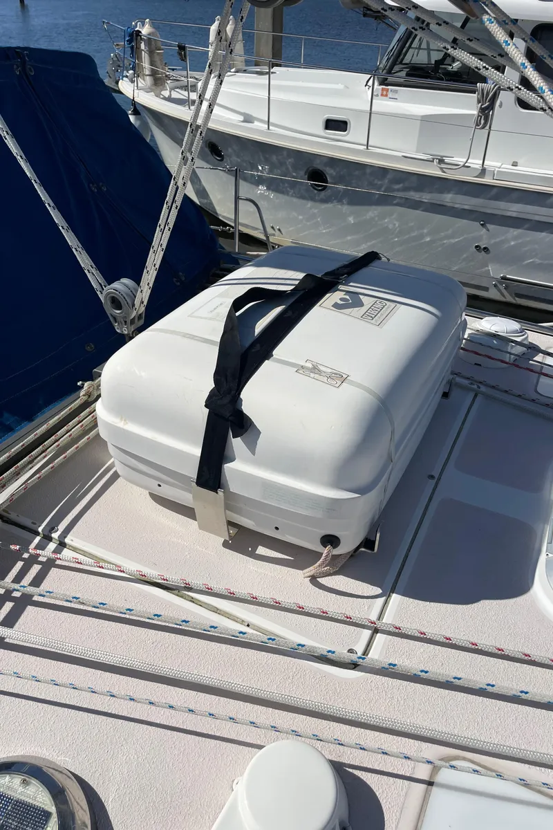 Slide: The Image of Catalina 400 sailboat deck with secured white storage box, 1998 model. - 47