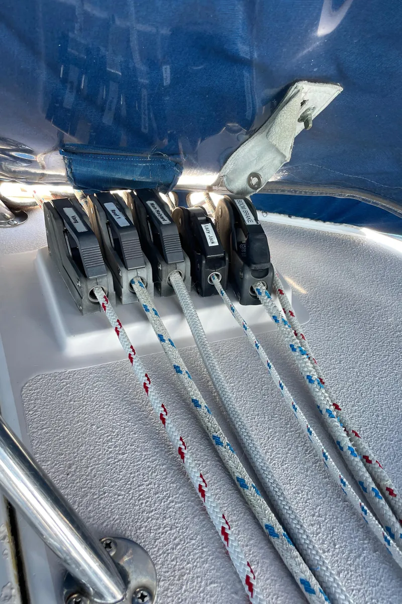 Slide: The Image of Close-up of Catalina 400 sailboat rope clutches, 1998 model, with colorful ropes and metal fittings. - 49