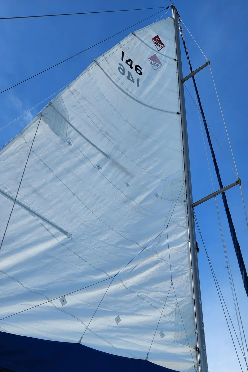 Slide: The Image of Sail of a 1998 Catalina 400 yacht against a clear blue sky. - 8