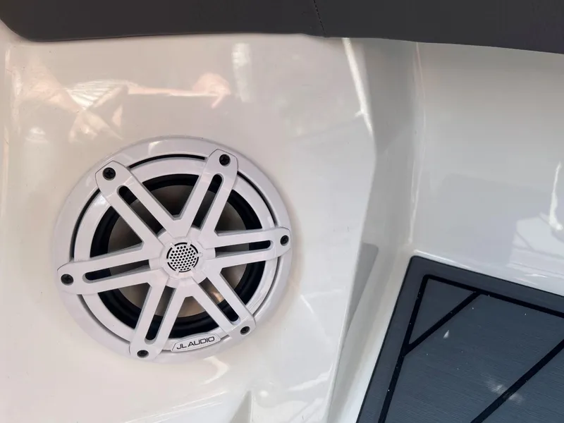 Slide: The Image of White JL Audio speaker on 2026 Cobalt R4 boat interior. - 10