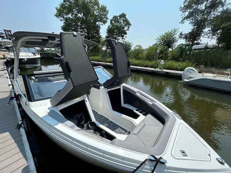 Slide: The Image of 2026 Cobalt R4 boat docked, featuring sleek design and comfortable seating. - 18