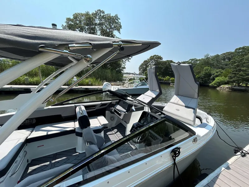 Slide: The Image of 2026 Cobalt R4 boat docked on a sunny day, featuring sleek design and comfortable seating. - 20