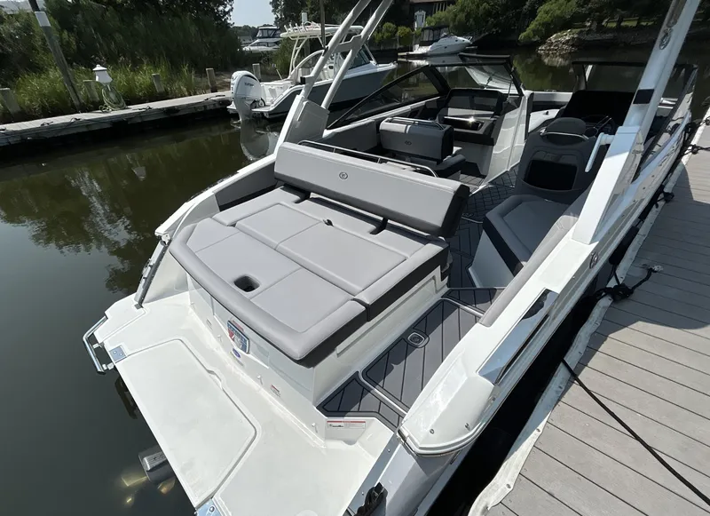 Slide: The Image of 2026 Cobalt R4 boat docked, featuring sleek design and spacious seating. - 3