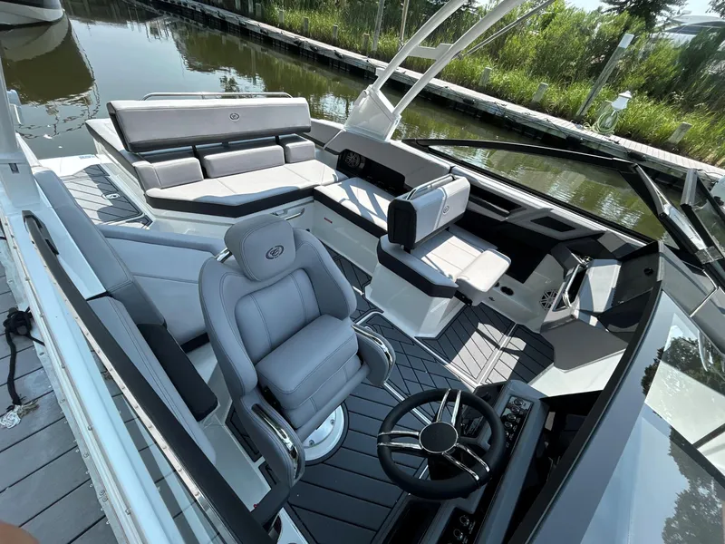 Slide: The Image of Luxurious 2026 Cobalt R4 boat interior with sleek seating and modern steering design. - 9